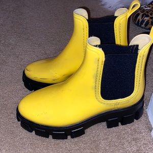 Yellow and black rain boots